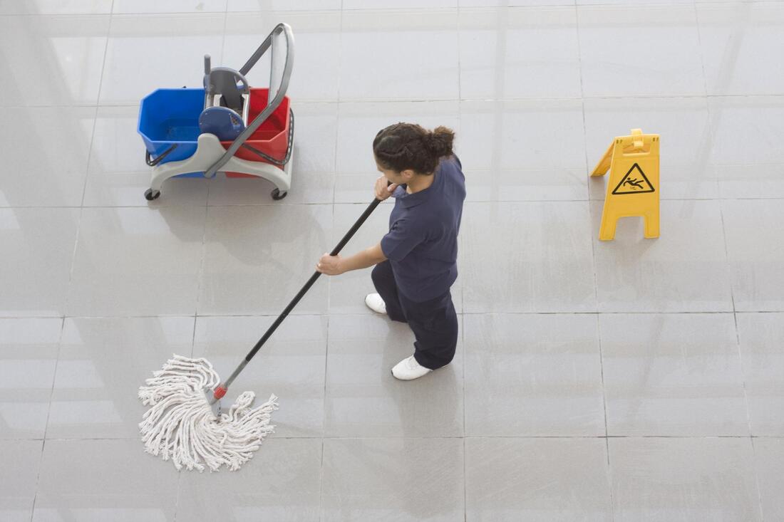 worker using a mop